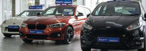 Cars on forecourt with Close Brothers Motor Finance number plates 